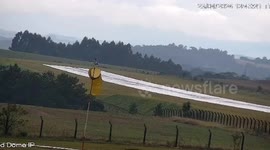 Private jet overshoots runway before skidding down grass bank