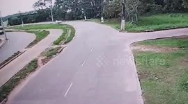 Bin lorry topples over on road bend in Brazil