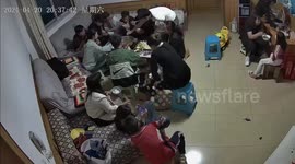 Ceiling collapses while family have meal together in China