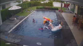 Drowning boy, 5, saved after falling from inflatable toy in swimming pool (extra footage)