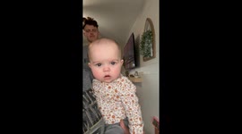 Little girl batlles with the overenthusiastic echoes of her dad's impromptu concert