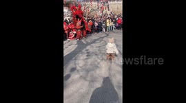 China: Child at teh lion dance performance in Shandong
