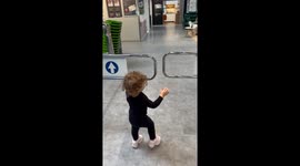 Toddler Loses Against Supermarket Mechanical Gate