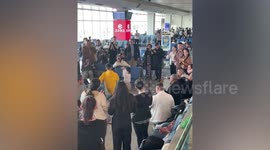 Girl performs awesome dance in airport departure lounge