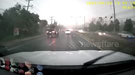 Electric sparks from power line shower highway during storm in Thailand