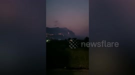 Wildfire rages on mountain in Thailand
