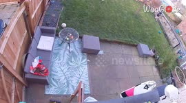 Young boy's unplanned descent through the patio table