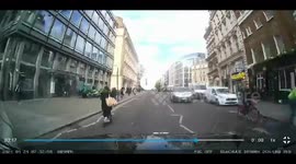 London taxi encounter: scooter swerve as horse surprises road