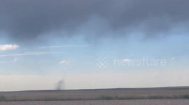 Watch as tornado touches down in Colorado with blue skies in the distance