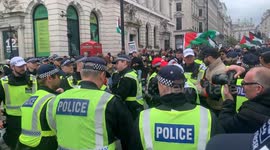 Police arrest a pro-Palestine protestor at a 'Stop Arming Israel, Ceasefire Now!' national demonstration in Central London on Saturday, 27 April 2024.