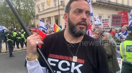 Itai Galmudy of the 'Enough is Enough' pro-Israel group speaks in front of pro-Israel counter-protestors at the pro-Palestine 'Stop Arming Israel, Ceasefire Now!' national demonstration in Central London on Saturday, 27 April 2024.
