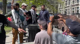 CUNY: Counter-protester surrounded by demonstrators at pro-Palestinian encampment and spoken to by campus security officers
