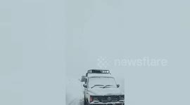 Officials retrieve 35 stranded vehicles after snow storm hits northern India