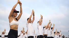 Yoga fanatics have mass workout on airport runway in Bangkok
