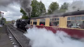 Severn valley Railway steam locomotive 75069 leaving the station with immense steam.