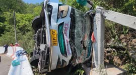 Tour bus flips over killing one and injuring 28 in western Thailand