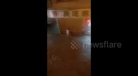 Pharmacy owners rescue boy swept away in floodwaters in southern China