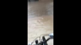 Bicycle rider takes a splash in Resistencia, Argentina!