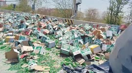 Thousands of bottles of beer spill onto road when truck topples over
