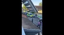 Emergency services at scene where public and police injured by sword-wielding man in Hainault