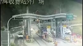 Giant boulder plummets from mountain, strikes highway near Chinese toll gate