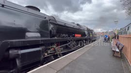 A great steam engine locomotive pulls into Severn valley railway station in Bridgnorth Shropshire.