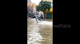 Man takes to jet ski adventure in deep floodwater amidst torrential rain in southern China