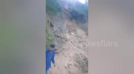 Heavy rain triggers landslides in northern India, leaving houses damaged