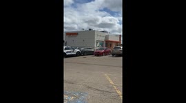 Police blockade alleged car thief in parking lot