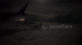 Passenger records lightnings outside plane's window in southern China