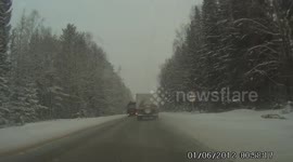 SUV Loses control and crashes into a truck