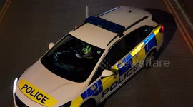 Another Wiltshire police officer joins the first in blocking off access to an industrial estate where an illegal car meet is taking place.