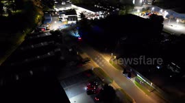Wiltshire Police attended an illegal car meet where they pulled over a biker on blue lights. No audio just visuals filmed from a drone.