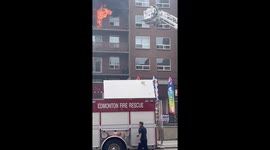 Man and cat escape apartment fire