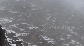 Indian devotee braves harsh weather as he sits atop snowy mountain to meditate