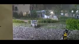Driverless tricycle navigates college amid hailstorm in northern China