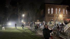 Pro-Israel counter protesters with Pro-Palestinian protesters who have set up an encampment at UCLA in Los Angeles