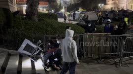 Pro-Israel counter protesters with Pro-Palestinian protesters who have set up an encampment at UCLA in Los Angeles