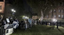 Pro-Israel counter protesters with Pro-Palestinian protesters who have set up an encampment at UCLA in Los Angeles