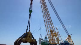 Hydraulic claw tackles Baltimore bridge wreckage