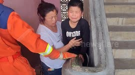 Firefighters free playful boy from being trapped in school staircase