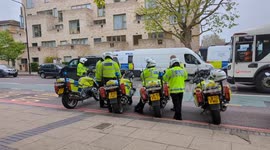 Police at scene where protesters are blocking coach transporting asylum seekers to Bibby Stockholm