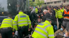 Police attempt to remove protesters blocking coach set to take asylum seekers to Bibby Stockholm
