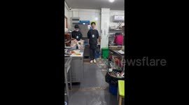 China: The waiter tried to march but slipped and fell