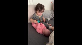 Caring big bro super proud of himself after newborn sister takes pacifier from him