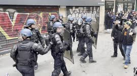 Police officers are forced back by protesters and mistakenly teargas themselves