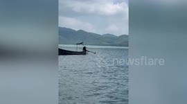Waterspout tornado swirls across sea on Thai island