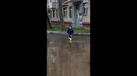 Child's puddle adventure: one boot misadventure