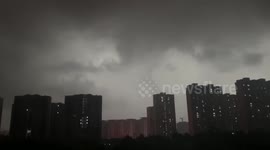 Thick black storm clouds turn day into night in Chinese city