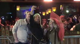 May Bank Holiday revellers paint the town red on Friday night despite miserable weather in Birmingham, England